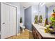 Bathroom with tile floors, neutral walls, and double vanity with plenty of decor at 3832 Augustine Pl, Rex, GA 30273