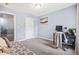 Cozy bedroom featuring gray walls, carpeted floors, daybed, and an adjacent desk area at 3832 Augustine Pl, Rex, GA 30273