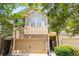 Charming two-story townhouse with a brick facade, attached garage, and mature landscaping at 3832 Augustine Pl, Rex, GA 30273