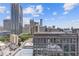 Daytime view of the surrounding city buildings with a blue sky at 400 W Peachtree St # 2108, Atlanta, GA 30308
