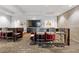 Resident coworking space with individual desks, comfortable seating, and a large-screen TV at 400 W Peachtree St # 2108, Atlanta, GA 30308