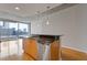 Contemporary kitchen with sleek countertops and an open layout with city views at 400 W Peachtree St # 2108, Atlanta, GA 30308