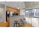 Modern kitchen with stainless steel appliances and a breakfast bar overlooking city views at 400 W Peachtree St # 2108, Atlanta, GA 30308