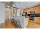 Modern kitchen with stainless steel appliances and a breakfast bar with seating at 400 W Peachtree St # 2108, Atlanta, GA 30308