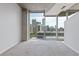 Living room with large windows and gray carpet overlooks the city skyline at 400 W Peachtree St # 2108, Atlanta, GA 30308