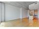 Open living room area featuring concrete ceilings and hardwood floors at 400 W Peachtree St # 2108, Atlanta, GA 30308