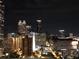 Night skyline view highlighting illuminated city buildings at 400 W Peachtree St # 2108, Atlanta, GA 30308