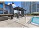 Inviting poolside lounge area with shaded pergola and comfortable seating overlooking the shimmering pool at 400 W Peachtree St # 2108, Atlanta, GA 30308