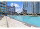 Beautiful swimming pool with lounge chairs, umbrellas, and city views, providing a perfect spot for relaxation and recreation at 400 W Peachtree St # 2108, Atlanta, GA 30308
