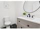 Modern bathroom featuring a stylish vanity with a vessel sink and black marble floors at 1266 Elizabeth Sw Ave, Atlanta, GA 30310