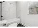 Bathroom featuring shower with white marble, toilet and tile floors at 1266 Elizabeth Sw Ave, Atlanta, GA 30310
