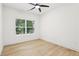 Bright bedroom with a ceiling fan and large window offering natural light at 1266 Elizabeth Sw Ave, Atlanta, GA 30310