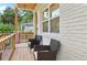 Close-up of a charming front porch with chairs, featuring a light brick wall and wood accents at 1266 Elizabeth Sw Ave, Atlanta, GA 30310