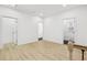 Hallway featuring multiple doors, railing, and hard surface floors at 1266 Elizabeth Sw Ave, Atlanta, GA 30310
