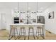 Bright kitchen featuring stainless appliances, bar seating, and a stylish design at 1266 Elizabeth Sw Ave, Atlanta, GA 30310