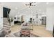 Open concept living space with modern lighting, and view into the kitchen with stainless appliances at 1266 Elizabeth Sw Ave, Atlanta, GA 30310