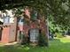 Residential home with brick facade, surrounded by a green lawn and mature trees at 455 Crafton Ct, Lawrenceville, GA 30043