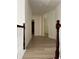 Upstairs hallway with wood-look flooring and neutral paint at 455 Crafton Ct, Lawrenceville, GA 30043