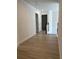 Hallway featuring wood-look floors and multiple doorways at 455 Crafton Ct, Lawrenceville, GA 30043