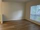 Empty room with hardwood floors, large window, and neutral paint color at 455 Crafton Ct, Lawrenceville, GA 30043