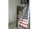 Bright entryway featuring a staircase with wooden handrail and white risers at 455 Crafton Ct, Lawrenceville, GA 30043