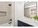 Modern bathroom with subway tiled shower, sleek fixtures, and a stylish mirror at 197 Holcomb Ferry Rd, Roswell, GA 30076