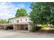 Townhome community featuring assigned covered parking spots and mature trees at 197 Holcomb Ferry Rd, Roswell, GA 30076