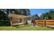 Nice backyard deck with a pergola and privacy fence, ready for summer fun at 2357 Whitehouse Rd, Dacula, GA 30019