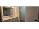 Bathroom with a spacious vanity and modern fixtures, connecting to a walk-in closet at 2357 Whitehouse Rd, Dacula, GA 30019