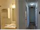 Half bathroom with neutral walls, modern fixtures, marble sink, and vanity storage at 2357 Whitehouse Rd, Dacula, GA 30019