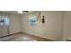 Bedroom with natural light, modern flooring, and unique violin wall decor at 2357 Whitehouse Rd, Dacula, GA 30019