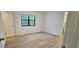 Cozy bedroom with hardwood floors and a window, offers a serene retreat at 2357 Whitehouse Rd, Dacula, GA 30019