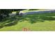 Lush front yard with manicured lawn and vibrant flower beds, adding curb appeal at 2357 Whitehouse Rd, Dacula, GA 30019