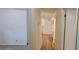 Bright hallway with hardwood floors connecting living areas, offering seamless flow at 2357 Whitehouse Rd, Dacula, GA 30019
