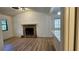 Inviting living room features a stone fireplace and hardwood floors at 2357 Whitehouse Rd, Dacula, GA 30019