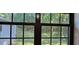 Window view of the backyard with lush greenery at 2357 Whitehouse Rd, Dacula, GA 30019