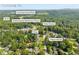 An aerial view showcases the home's proximity to Chattahoochee Elementary, Cumming Central Park and Dollar General in Cumming, GA at 2560 Fairlane Dr, Cumming, GA 30041