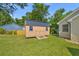 Backyard view of shed with a metal roof and ramp at 2560 Fairlane Dr, Cumming, GA 30041