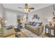 Bedroom featuring a comfortable sofa, desk space, and stylish decor at 2560 Fairlane Dr, Cumming, GA 30041