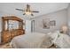 Bedroom featuring a bed and a dresser with decorative mirror, and floral artwork on the wall at 2560 Fairlane Dr, Cumming, GA 30041