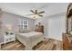 Bedroom featuring a bed, a dresser and a nightstand with decorative accents at 2560 Fairlane Dr, Cumming, GA 30041