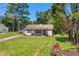 Charming single-story home featuring a covered porch and a lush, well-maintained front yard at 2560 Fairlane Dr, Cumming, GA 30041