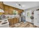 Charming kitchen featuring wood cabinets, stainless steel appliances, and a bright window at 2560 Fairlane Dr, Cumming, GA 30041