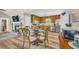 Open-concept eat-in kitchen and dining area with modern appliances and hardwood floors at 2560 Fairlane Dr, Cumming, GA 30041