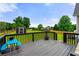 A backyard features a deck, small shed, and lush green lawn with ample space at 71 Barrington Dr, Hiram, GA 30141
