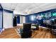 Finished basement includes a seating area, desk and a view of a closet and doorway at 71 Barrington Dr, Hiram, GA 30141