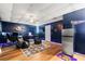 Finished basement with seating area, hardwood floors, and stainless steel refrigerator at 71 Barrington Dr, Hiram, GA 30141