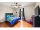 Bright bedroom features a ceiling fan and a large window at 71 Barrington Dr, Hiram, GA 30141