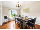 Stylish dining area with a large table, modern seating, and plenty of natural light, perfect for Gathering meals at 71 Barrington Dr, Hiram, GA 30141