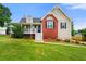 Charming two-story home with a brick accent, manicured lawn, and a welcoming porch, perfect for relaxing outdoors at 71 Barrington Dr, Hiram, GA 30141